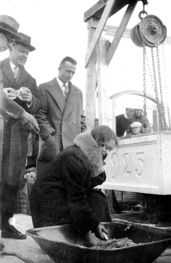 This is likely Elizabeth Stickney '26, senior class vice president, using a trowel to place mortar during the laying the cornerstone for the Gray Athletic Building on Dec. 14, 1925. (Muskie Archives and Special Collections Library)