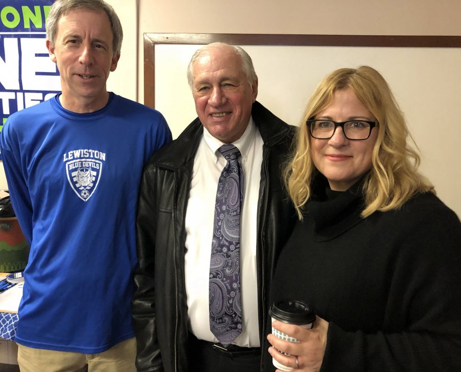 Amy Bass ’92 (right) poses with attends a meet-and-greet at the Maine Immigrant and Refugee Services offices during her visit to Lewiston and Bates to promote her book One Goal. In some photos are Kim Wettlaufer ’80 (blue longsleeve shirt) Shobow Saban, one of the key figures in her book, wears a dark blue sportcoat with no tie.