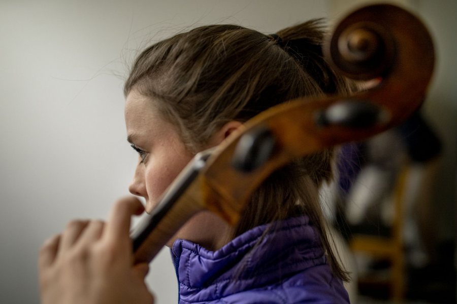 Courtney Tally '23 of Hanover, N.H., has been playing the cello since first grade, and 13 years later, she's a member of the Bates College Orchestra. This afternoon, she practiced Bach's Cello Suites in a first-floor Olin Arts Center practice room.