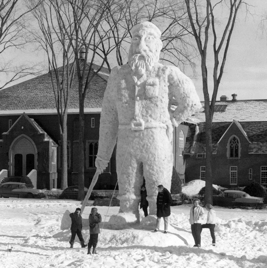 The 1962 Paul Bunyan snow sculpture attracts visitors during the Winter Carnival of 1962. (Muskie Archives and Special Collections Library)