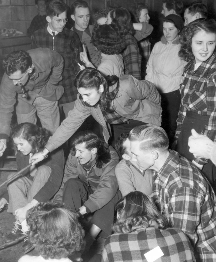 Students enjoy a cabin party at the Stanton Lodge at Thorncrag Nature Sanctuary, circa 1950. (Muskie Archives and Special Collections Library)