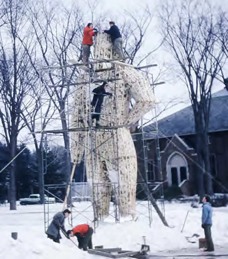 Bates students work on the Bates Outing Club's Paul Bunyan snow sculpture in 1962. (Courtesy of The Legend)