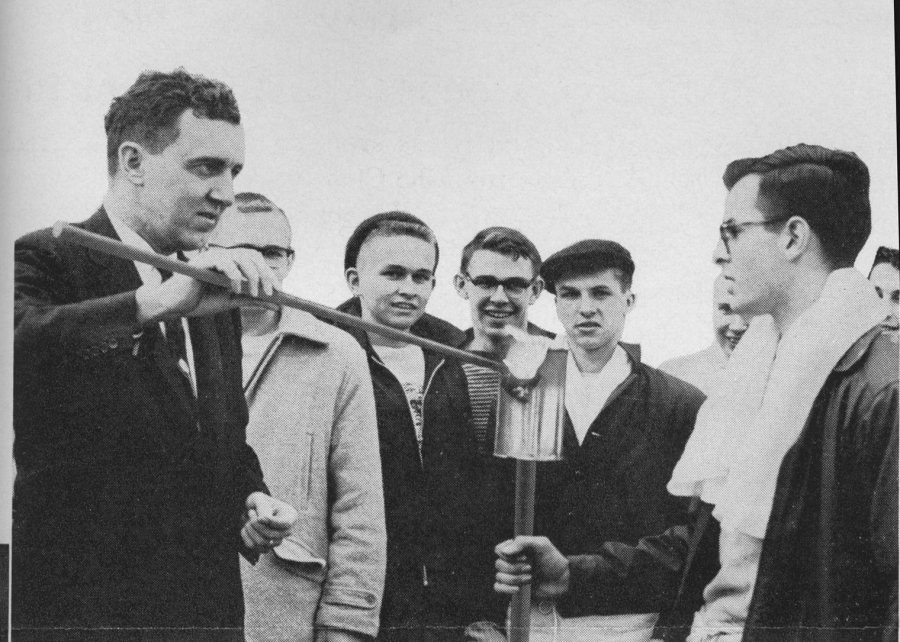 Then-Maine Gov. Edmund Muskie '36 lights a torch to kick off Winter Carnival. (Muskie Archives and Special Collections Library)