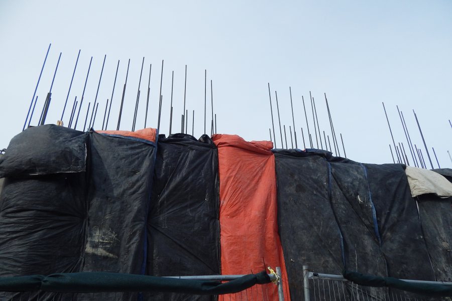 New concrete is curing under thermal blankets at the east end of the Bonney Science Center. (Doug Hubley/Bates College)
