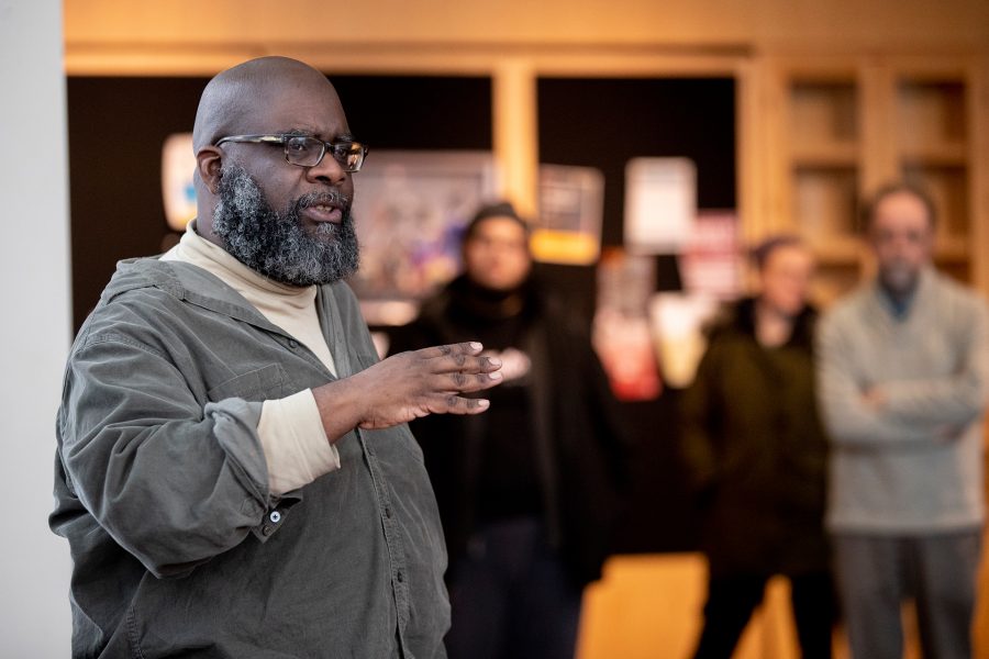 Lecturer in Theater Clifford Odle addresses viewers in the Commons Fireplace Lounge during the Feb. 6 performance of his short play According to Mark. (Phyllis Graber Jensen/Bates College)