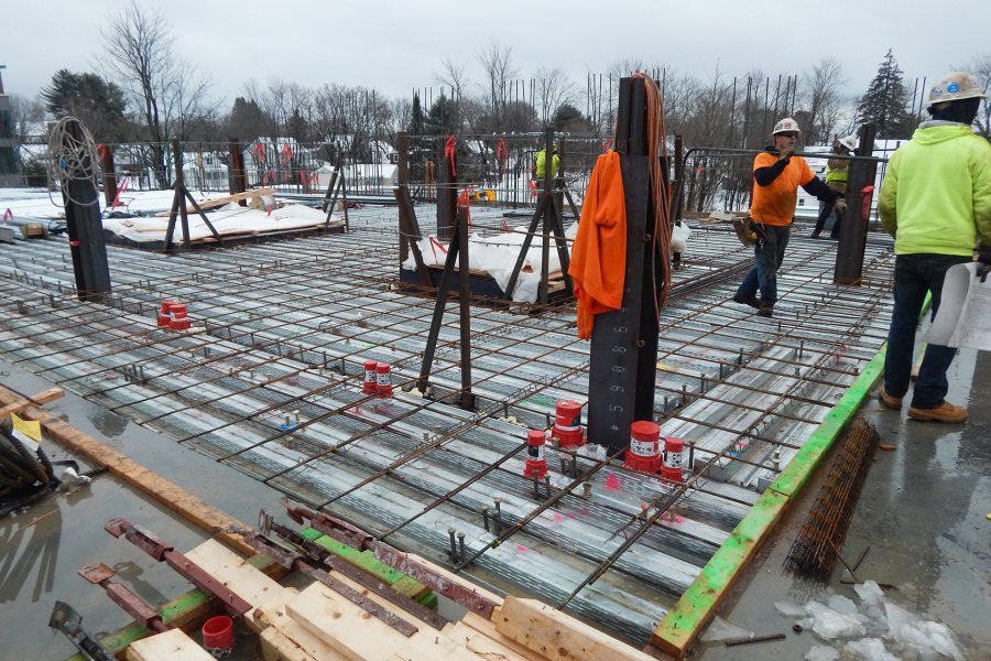 A scene from the second floor of the Bonney center on Feb. 10. A concrete slab will soon conceal the rebar and decking on the floor. (Doug Hubley/Bates College)