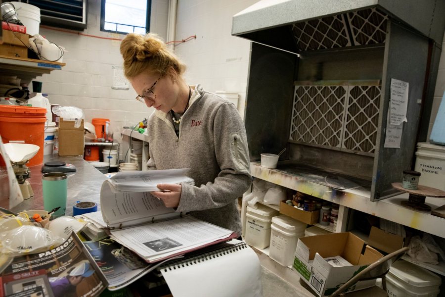 Olin Arts CenterTalia Binns '20 protects her lungs with a mask as she mixes creamics glazes in the ceramics kitchen adjacent to the kiln.