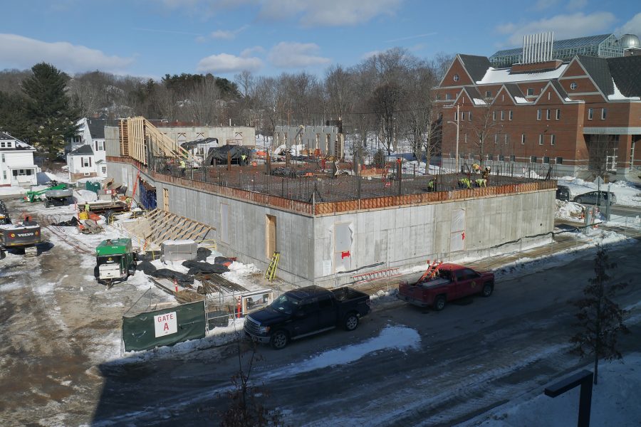 The Bonney Science Center seen from the east on Feb. 20, 2020. "Rod busters" are wiring down rebar for the second-story floor slab at the right, and at rear, wall sections have been placed at the west end. (Doug Hubley/Bates College)