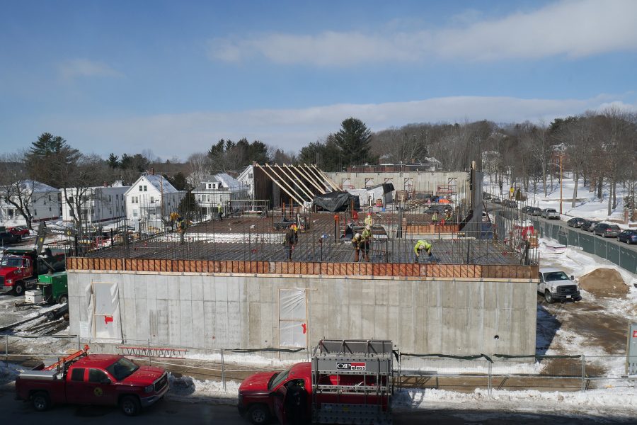 The east side of the Bonney Science Center seen from the third floor of Chu Hall on Feb. 20, 2020. The workers are "rod busters" wiring down rebar in preparation for the placement of the concrete floor slab. (Doug Hubley/Bates College)