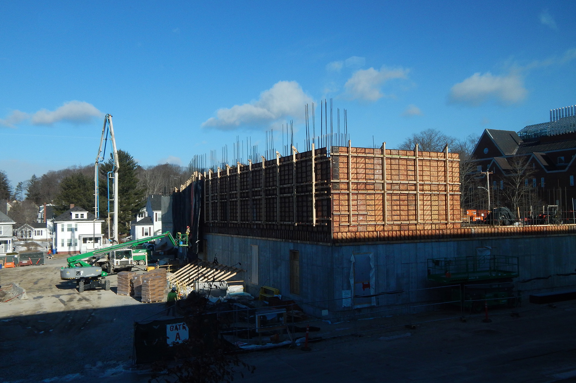 A southeastern view of the Bonney building from the third floor of Chu Hall on Feb. 28, 2020. Note the concrete pump at left. (Doug Hubley/Bates College)