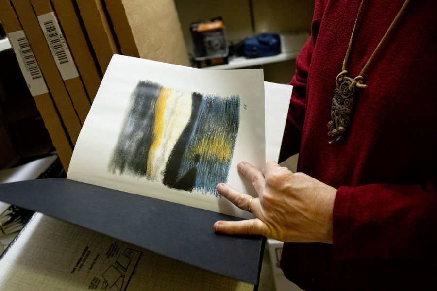 Jane Costlow, Clark A. Griffith Professor of Environmental Studies, checks environmental studies senior theses in her Hedge 112 office, and some in the ES lounge, and others in a storage closet.