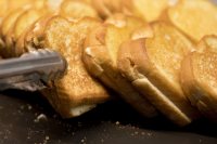 Kevin Michaud of Dining Services makes the beloved grilled cheese sandwiches in Commons that he readies during Friday lunch.