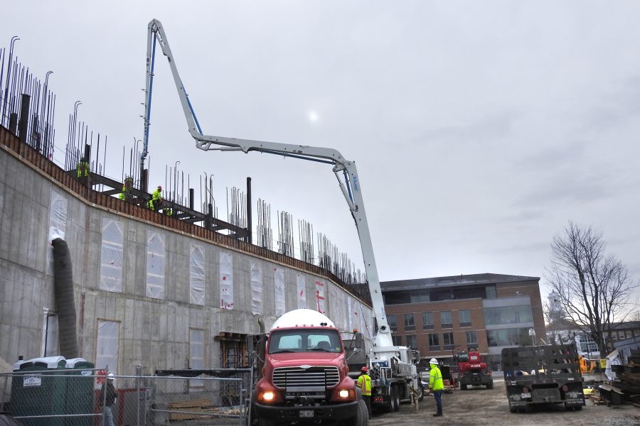 The pumper places concrete for a section of third-story wall on the Bonney center's south face on March 23. (Jay Burns/Bates College)