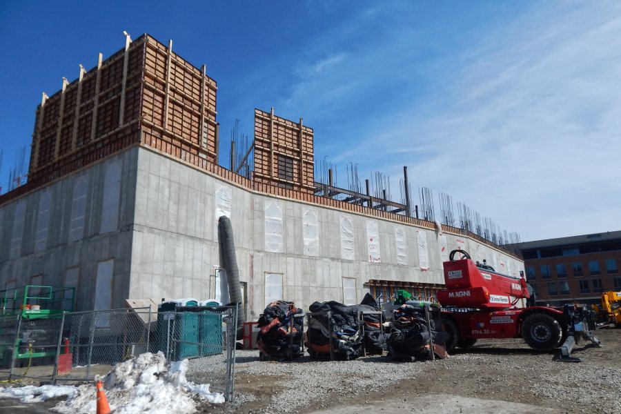 Seen from Nichols Street on March 25, Symons concrete forms are appearing for the west and  south third-story walls of the Bonney Science Center. (Doug Hubley/Bates College)