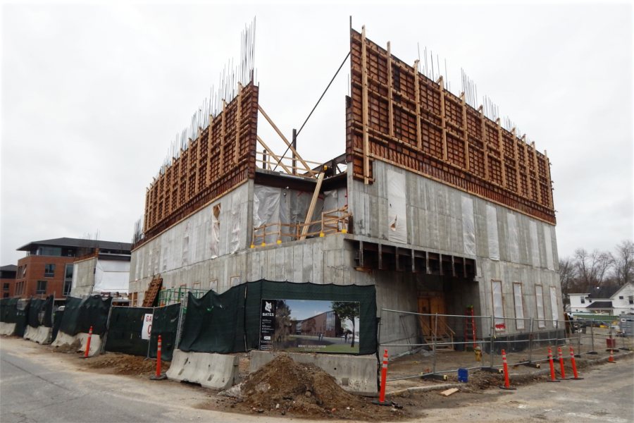 Now and then: A rendering of the Bonney Science Center is dwarfed by the building itself, seen from the intersection of Campus Avenue and, at right, Nichols Street. (Doug Hubley/Bates College)