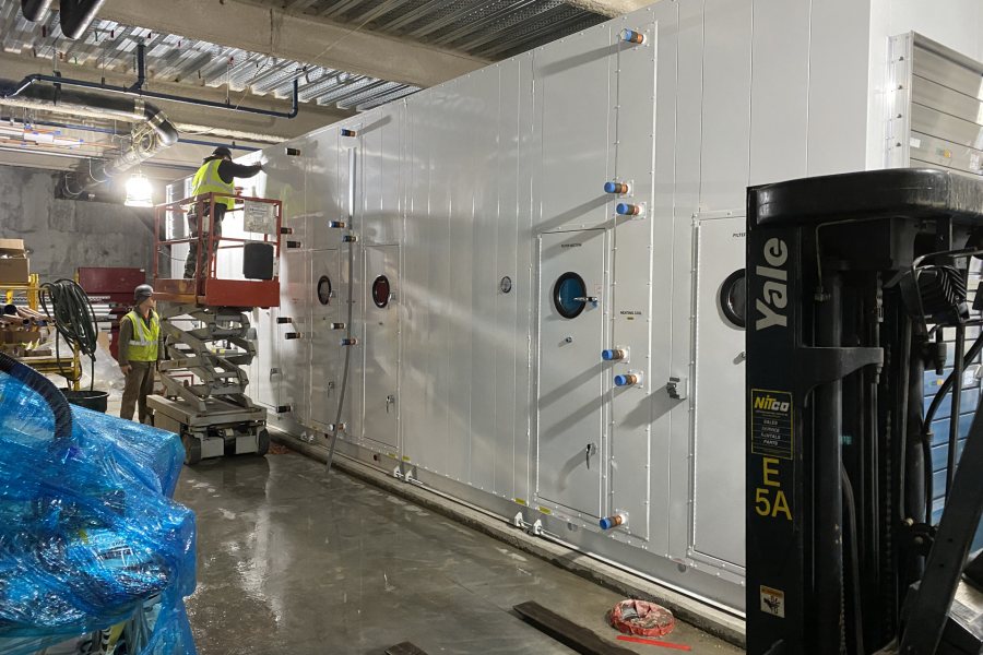 One of three air handlers shoehorned into the Bonney Science Center basement on April 3. Two are this size and the third, which will serve only the vivarium in the basement, is smaller. (Geoffrey Swift/Bates College)