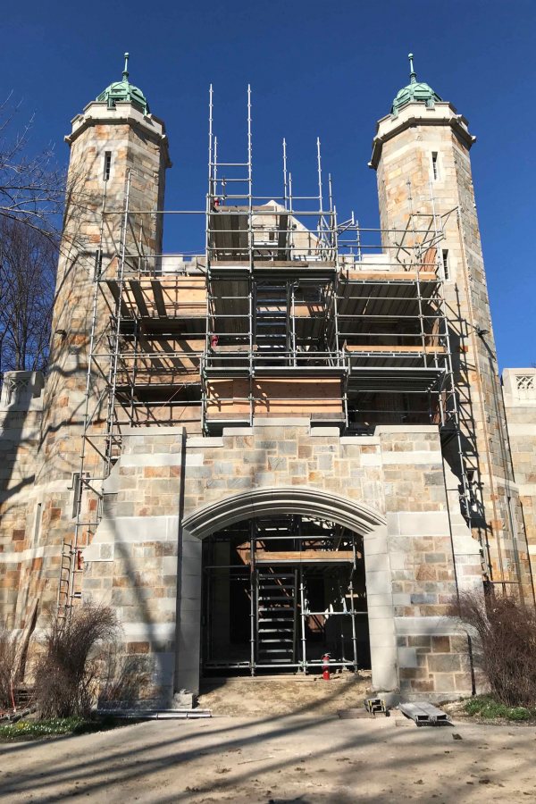 This view of the Gomes Chapel's south facade shows staging that workers are using to get at the large decorative windows that will be restored this year. (Courtesy of Consigli Construction)