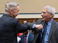 Dr. Anthony Fauci, director of the Institute of Allergy and Infectious Diseases at the National Institutes of Health, gives an elbow-bump greeting to Rep. Stephen Lynch, D-Mass., before a House Committee on Oversight and Reform hearing on the coronavirus situation, March 11, 2020, on Capitol Hill. (Joe Gromelski '74 / Stars and Stripes)