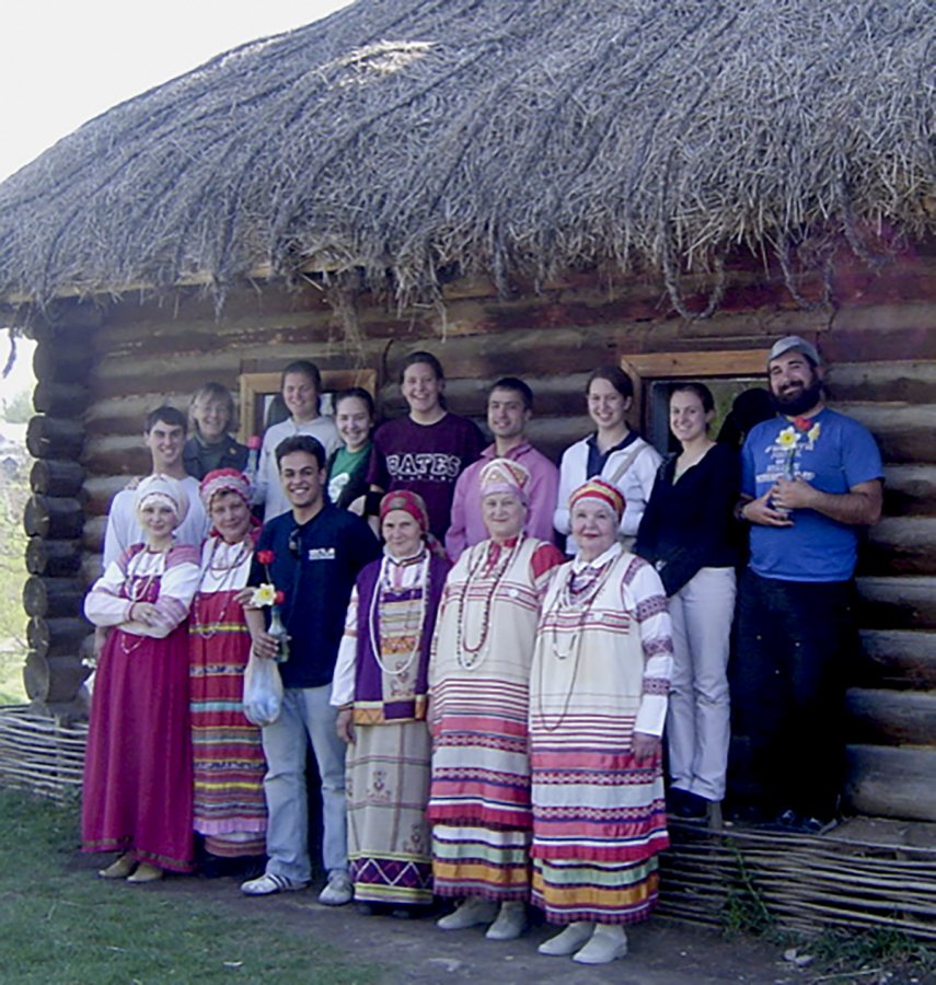 Costlow poses with her students in 2006 in front of the "coachman's cottage" on Tolstoy's estate, Yasnaya Polyana, near Tula. The folk ensemble had just performed. (Courtesy Jane Costlow)