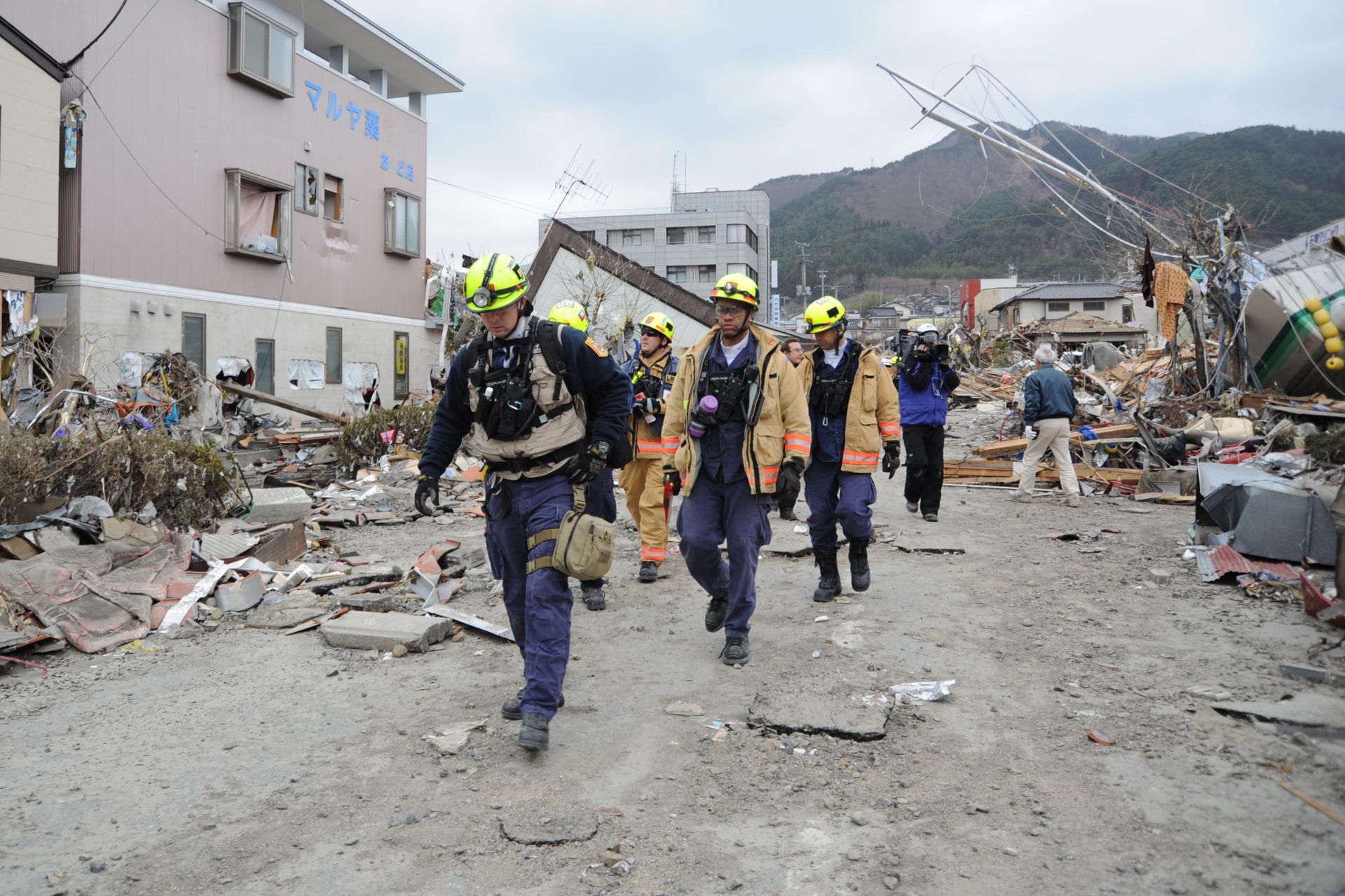 Members of the Fairfax County Urban Fire and Rescue Team head into downtown Ofunato to search for survivors following an 8.9-magnitude earthquake, which triggered a devastating tsunami through this Japanese coastal city. Teams from the United States, United Kingdom and China are on scene to assist in searching for missing residents.
