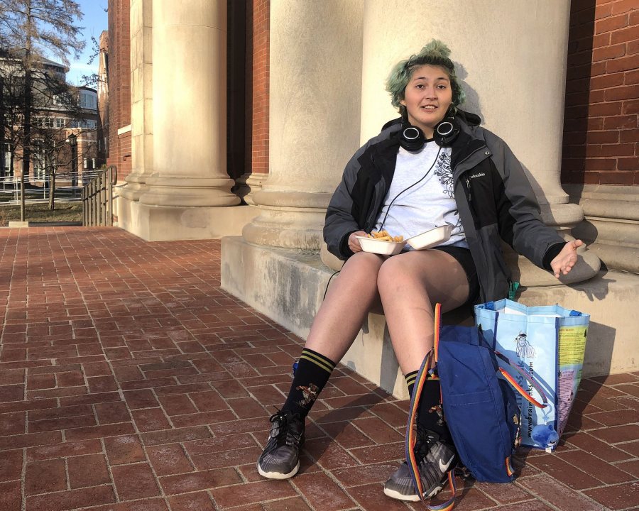 "I like just taking time to sit out here and get some fresh air." On a warm April afternoon, Alexis Fifield '21 of Guatemala City, Guatelema, finishes dinner, including some comfort food, french fries.