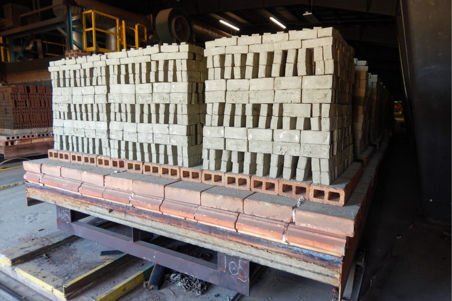 Green brick is stacked on a car waiting to be pulled through the Morin Brick Company kiln and fired. Baked brick is shown on the car at far left. (Doug Hubley/Bates College)