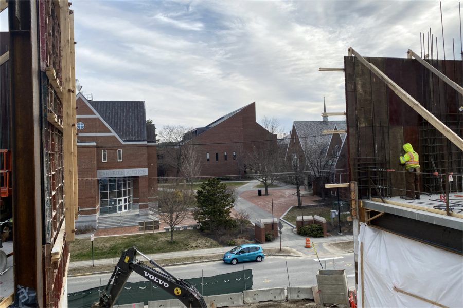 A view of (from left) Carnegie Science Hall, Ladd Library, and Chase Hall, seen from the third floor of the Bonney Science Center. This gap in the exterior wall will be the location of the "monumental stairs," a visual highlight of the new building. (Geoff Swift/Bates College)