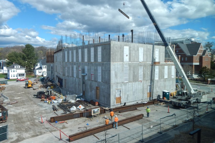 Seen from the third story of Chu Hall, a crane places steel joists to support the penthouse floor of the Bonney Science Center on May 4. (Doug Hubley/Bates College)