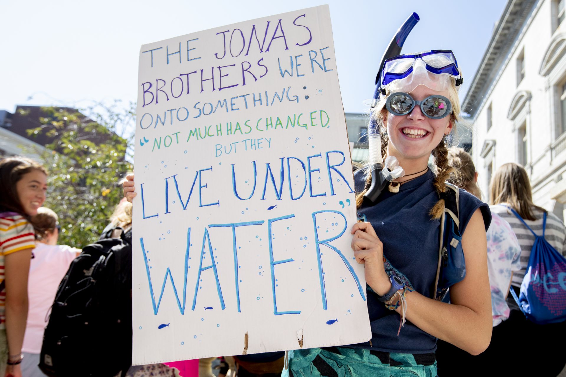 Geology major Essie Martin '21 of Newcastle, Maine, with Live Under Water Poster and goggles, and philosophy major Jasper Beardslee '22, also with goggles. He says,"I'm here today to support climate action."“I can't believe I'm even having to protest this.”.— Muskan Verma '21 of Shimla, India, shares the frustration of inaction on global climate change after she addressed a crowd of at least 2,000 at Portland City Hall gathered for the student-mobilized Global Climate Strike, ahead of the opening of the United Nations General Assembly and the Climate Action Summit on Sept. 23..“I'm not from this country,” she said. “But that shouldn't matter. This is affecting us all. And whether we like it or not, we have to take action.”.A representative of the Sunrise Movement, a youth-led movement for climate-change action, Verma is a double major in theater and in rhetoric, film, and screen studies. She joined a large contingent of Bates students and several faculty who attended the event, organized, in part, by the Bates Environmental Coalition..