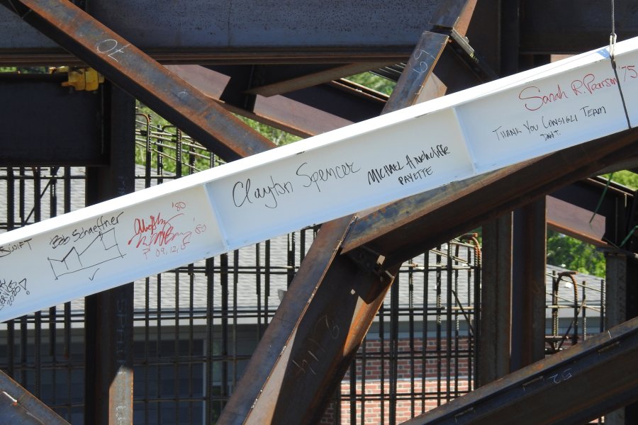 Signatures on the beam, now set in place. (Jay Burns/Bates College)