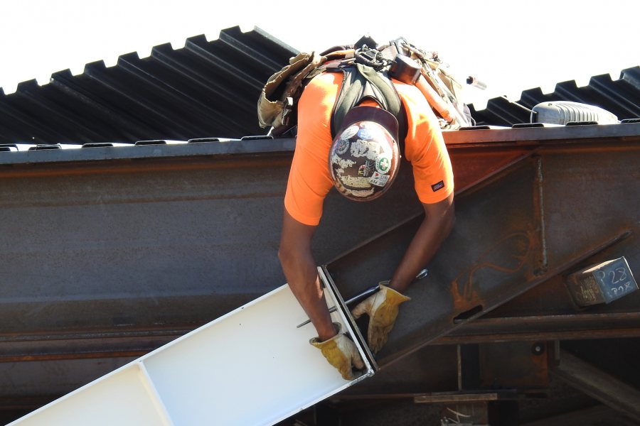 Bolts will be snug-tightened to keep the steel in place, and the connection will be torqued to specifications later. (Jay Burns/Bates College)