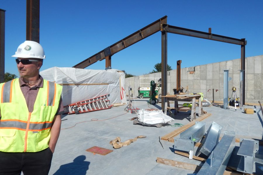 Jacob Kendall, Bates construction administrator for the Bonney project, surveys the fourth floor — aka the penthouse — on May 20. (Doug Hubley/Bates College