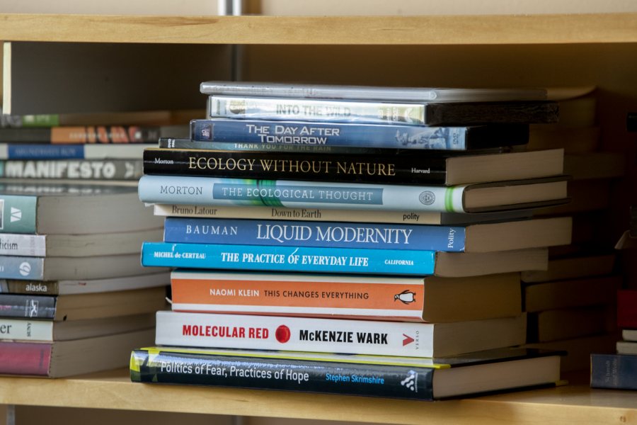 A pile of titles Costlow has selected for her successor sits on one of her office shelves. (Phyllis Graber Jensen/Bates College)
