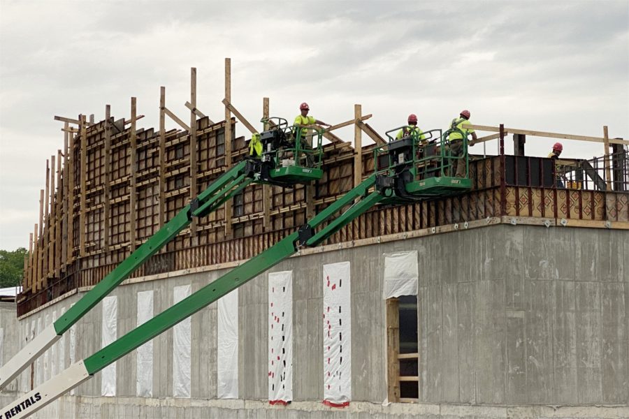 Tending to fourth-story concrete on June 5. (Geoff Swift/Bates College)