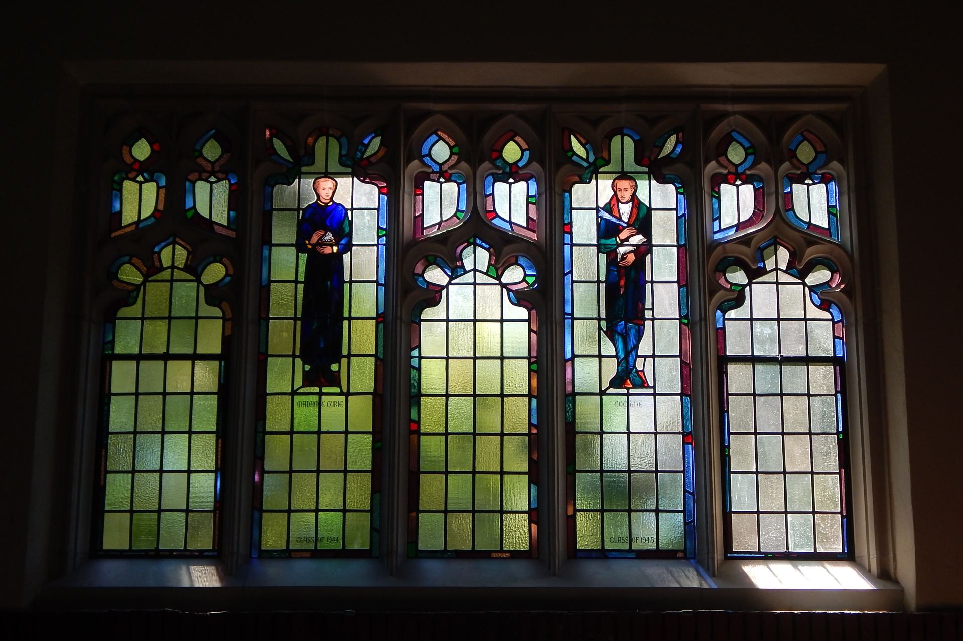 Newly restored by Maine Art Glass, Madame Curie and Herr Goethe are back in place in the Gomes Chapel. (Doug Hubley/Bates College)