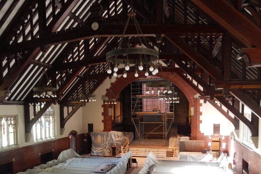 Seen from the rear gallery on June 8, at center is the Gomes Chapel chancel with its stained glass window out for restoration and staging in place. (Doug Hubley/Bates College)