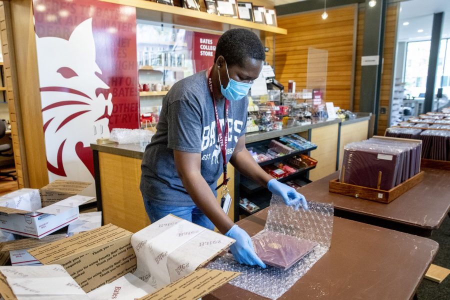 Staff gather in the College Store to pack and ship diplomas to graduates from the Class of 2020. The diplomas were dropped off by Mike Adams, Tim Kivus, and Adam Wright.

Those who volunteered to pack the pre-taped and assembled boxes that included tissue paper, all academic society/departmental honors/athletic certificates, alumni letter and CMH/CHS letter, printed and labeled theses, bumper stickers,  and diplomas:

Judith Otim
Gail St. Pierre
Donna Duval
Cheryl Lacey
Claire Schmoll
Christine Schwartz
Brenda Pelletier
Heather Taylor
Michelle Zuehika
Michelle Lewis
Kerry O'Brien