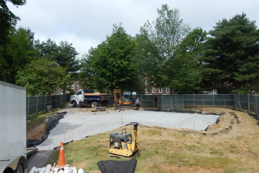 A black geotextile layer and a bed of crushed rock have been placed in preparation for the creation of a concrete slab at Veterans Plaza. (Doug Hubley/Bates College)