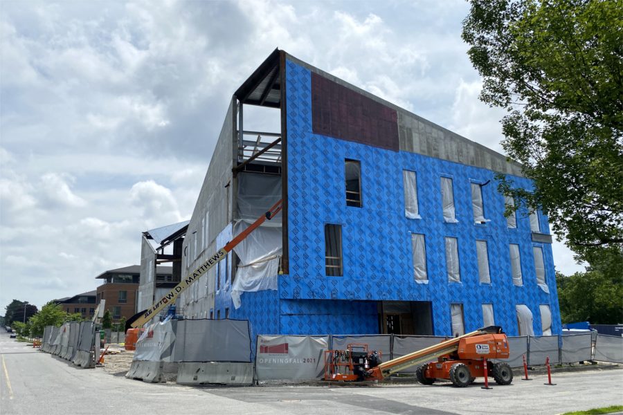 This July 10 view from Campus Avenue at Nichols Street shows the progress of blueskin application around the Bonney center. (Geoff Swift/Bates College)