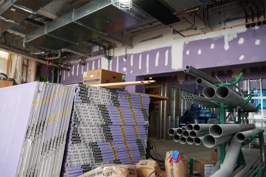 Drywall panels, PVC conduits, and other materials are ready to be used on the Bonney Science Center's first floor. (Doug Hubley for Bates College)
