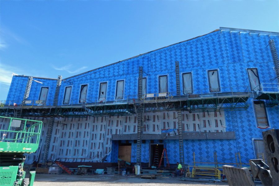 From the row of windows down to the ground and from the left corner to a line just out of view at right, it will take about 35,000 bricks to cover this expanse of the Bonney center's south face. (Doug Hubley for Bates College)