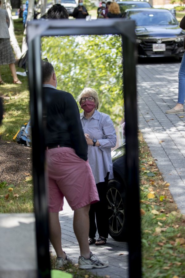 Day two of a three-day move in featured loads of luggage, spirited greetings, and emotional goodbyes. For a small taste of what we saw, swipe left.
Walking on Campus Avenue to her Chu Hall residence, OWL (Orientation Week Leader) Katia Ryan ’23 of Amsterdam, N.Y., swings her arms to express her excitement about returning to campus.
Today’s historic student move in was the first of three. Most first-years begin to arrive Wednesday and Thursday.