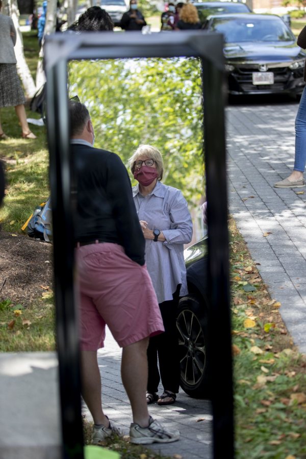 Day two of a three-day move in featured loads of luggage, spirited greetings, and emotional goodbyes. For a small taste of what we saw, swipe left.

Walking on Campus Avenue to her Chu Hall residence, OWL (Orientation Week Leader) Katia Ryan ’23 of Amsterdam, N.Y., swings her arms to express her excitement about returning to campus.

Today’s historic student move in was the first of three. Most first-years begin to arrive Wednesday and Thursday.