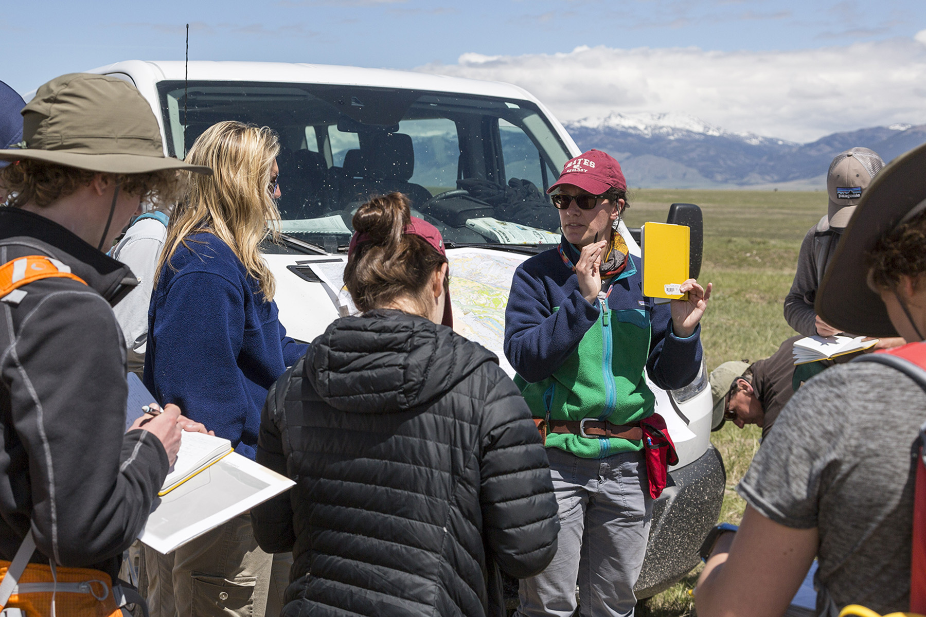 Professor Genevieve Robert introduces background information for the final mapping project of the course, a metamorphic puzzle near Ruby Creek, a few miles down the road from the Imerys Talc mine.

On Tuesday, May 17 2016, students in the Short Term course offering "Geology of the Northern Rockies and Columbia Plateau" visited the Yellowstone Mine run by Imerys Talc outside of Ennis, Montana, after which they began a two day metamorphic mapping project at nearby Ruby Creek.

Unlike the copper mining at Continental mine and past copper mining at the Berkeley Pit in Butte, the mining operations at Imerys produce comparatively little waste. This is because Montana has some of the purest Talc deposits on the planet. As a result, land reclamation processes are far more successful and faster to develop than reclamation processes for copper and other mining. 

The Imerys mine produces 250,000 tonnes of Talc annually to be used in the manufacturing of products such as soap, rubber, ceramics, paints, and paper. 

After the tour and a lunch break on the banks of the Madison river, the class continued on to nearby Ruby Creek to begin their final mapping project of the trip. 
The class then returned to West Fork campground for the night.