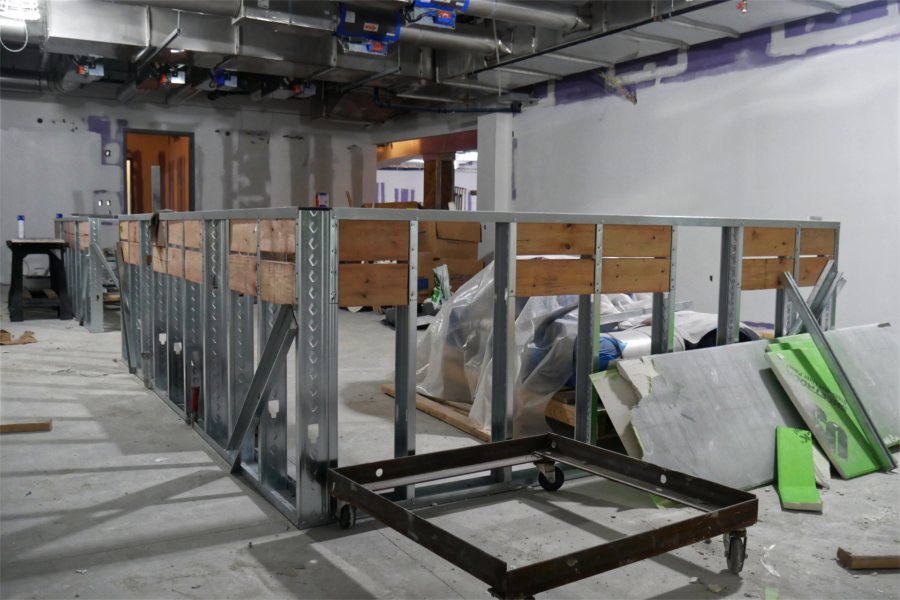 In this biochemistry classroom, the metal framework will be the basis of a counter where students will sit for lab briefings. Once briefed, they'll go to their lab stations around the perimeter. (Doug Hubley/Bates College)