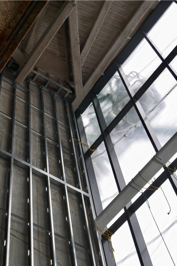 And here's the inside of the Beacon, with the plastic weather shield back in place. The silvery metal at left is wall studs and the dark metal will support window glass. (Doug Hubley/Bates College)