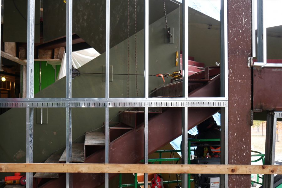 The Monumental Stairs are shown through wall studs on the second floor. The steel steps will be topped with polished concrete stairtreads. (Doug Hubley/Bates College)