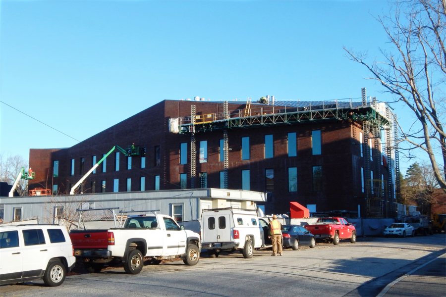 Now completely sheathed in brick, the south wall of the Bonney center  is shown early on Dec. 2, 2020. (Doug Hubley/Bates College)