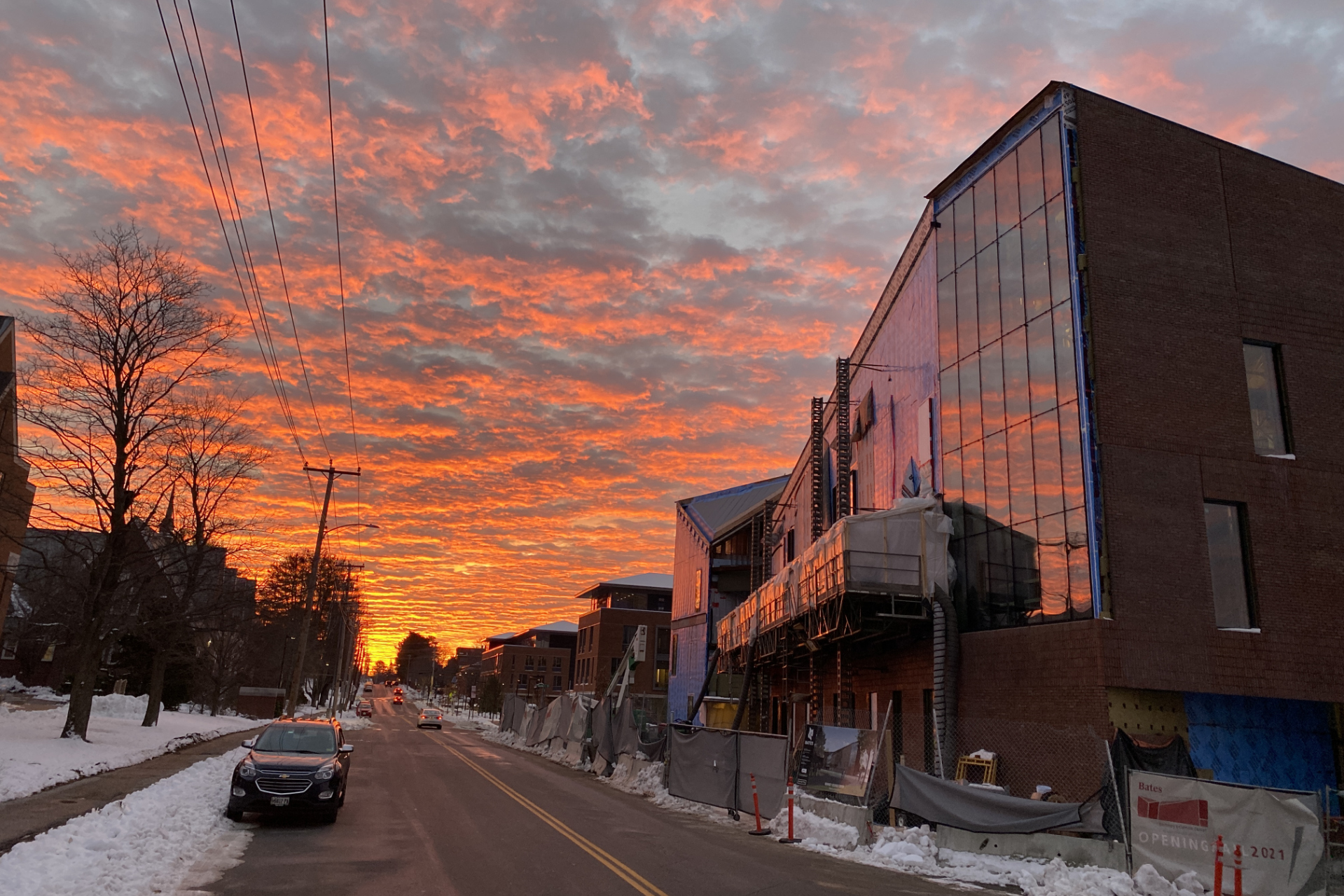 An otherworldly sunrise illuminates Campus Avenue and the Bonney Science Center on Dec. 11. (Geoff Swift/Bates College)