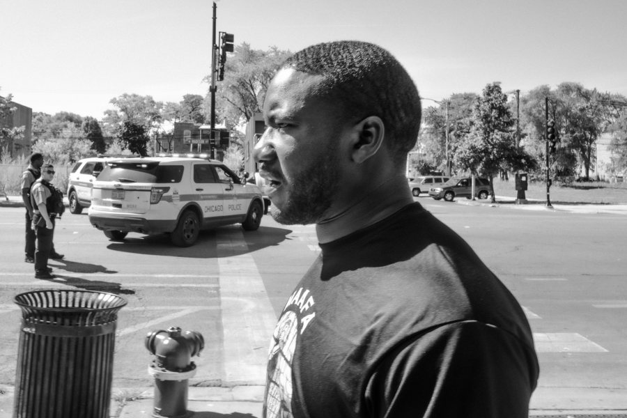 Rev. Marshall Hatch Jr. walks along Madison street, where Chicago Police department recently block traffic to the shopping district of West Garfield Park. “I contemplate James Baldwin’s a Fire Next Time,” said Hatch jr. “this is what he was talking about.” Tension rose on the Southside of Chicago were CPD had shot and killed a 20-year-old Black man.